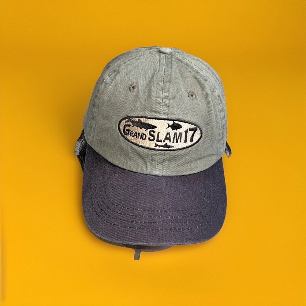 Grand Slam 17" embroidered baseball cap. Adjustable strap.